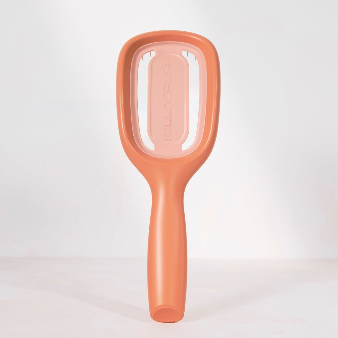 Brown plastic scoop on a white background