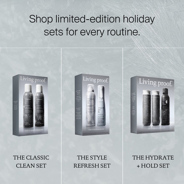 Promotional graphic for Living proof holiday sets, showing three boxed haircare sets on a light gray textured background: The Classic Clean Set, The Style Refresh Set, and The Hydrate + Hold Set.