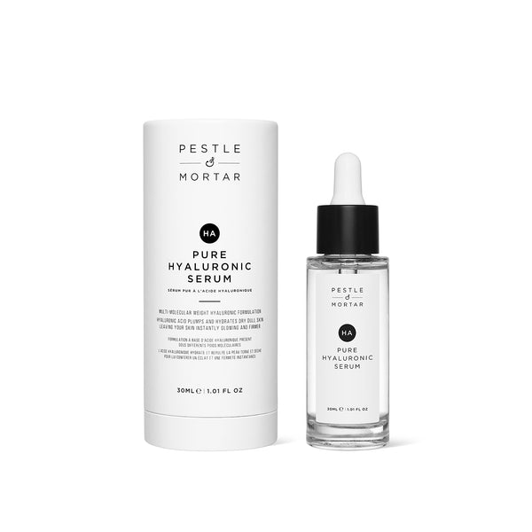 A bottle of Pestle & Mortar Pure Hyaluronic Serum with a dropper, next to its packaging.
