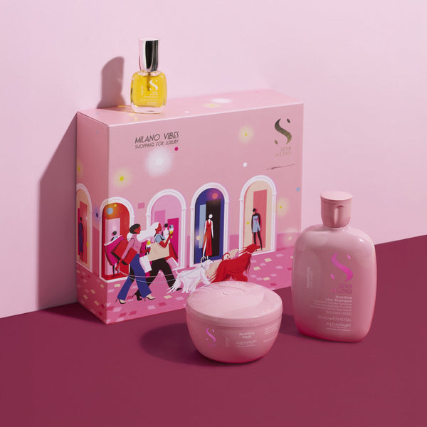 Pink skincare product set with a box on a pink background