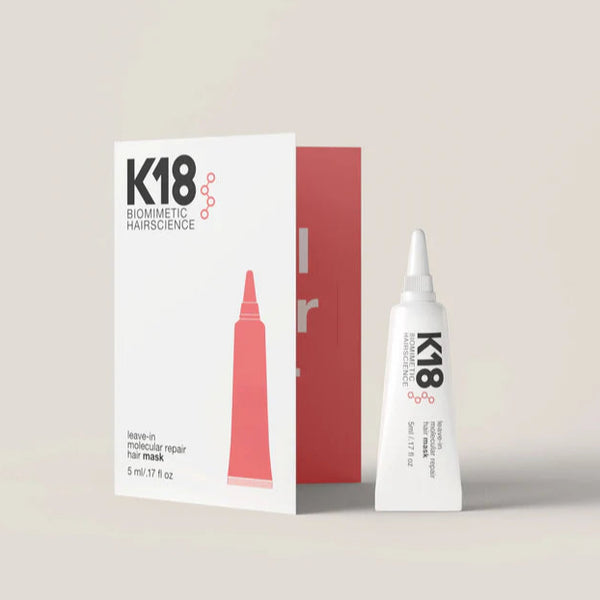 K18 hair mask packaging and tube on a light gray background