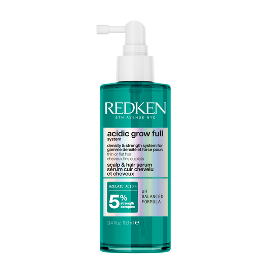 Redken bottle of acidic grow full hair product on a white background