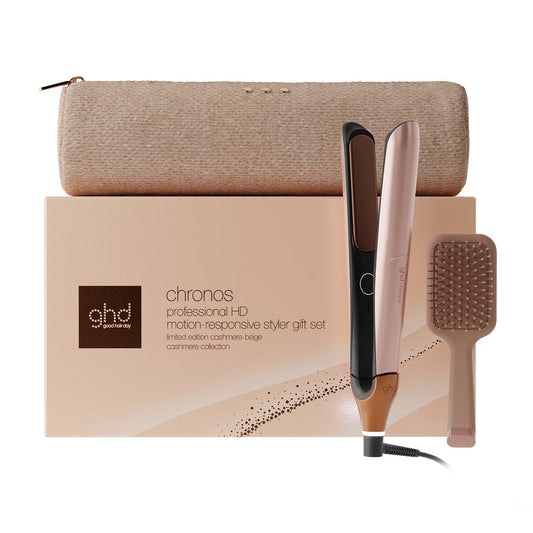 GHD Chronos professional H0 motion responsive styler gift set featuring a rose gold and black flat iron, a beige hairbrush, and a beige zippered pouch, arranged in front of the product box on a white background.