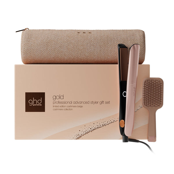 Ghds gold professional advanced stylist gift set featuring a flat iron, a hairbrush, and a storage pouch arranged in front of their branded packaging box on a white background.