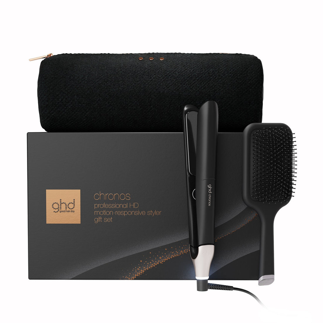 Ghds chronos professional hair straightener gift set featuring a black flat iron, black detangling brush, black zippered pouch, and black presentation box on a white background.