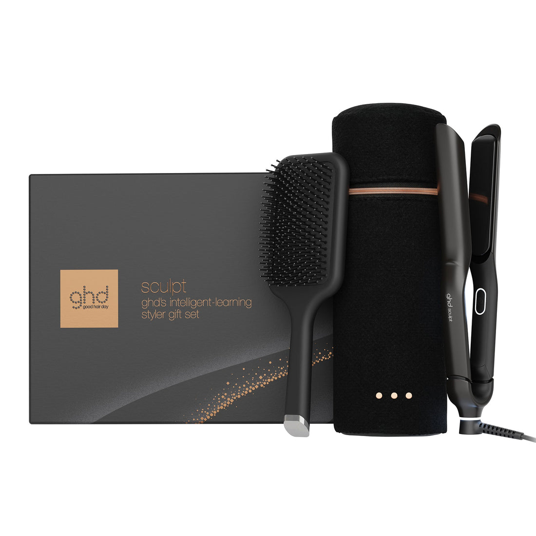 ghd Squid smart magnetic styling brush gift set, featuring a black smart brush, black flat iron, black cylindrical stand, and black styling brush attachment, displayed next to its dark gray and gold gift box on a white background.